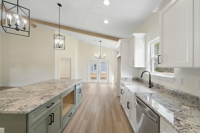 kitchen with white cabinets, lofted ceiling with beams, decorative light fixtures, and dishwasher