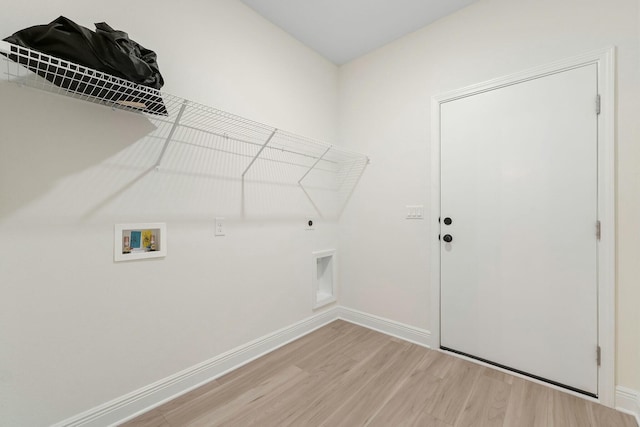 washroom with hookup for an electric dryer, washer hookup, and light hardwood / wood-style flooring