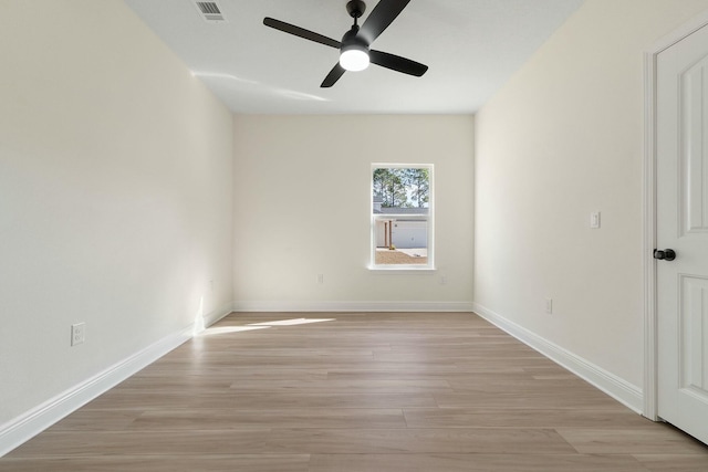 spare room featuring light wood-type flooring and ceiling fan