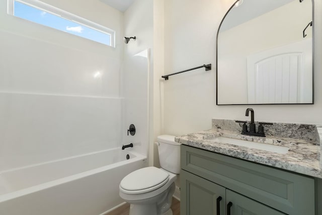 full bathroom with vanity, hardwood / wood-style floors, shower / bathing tub combination, and toilet