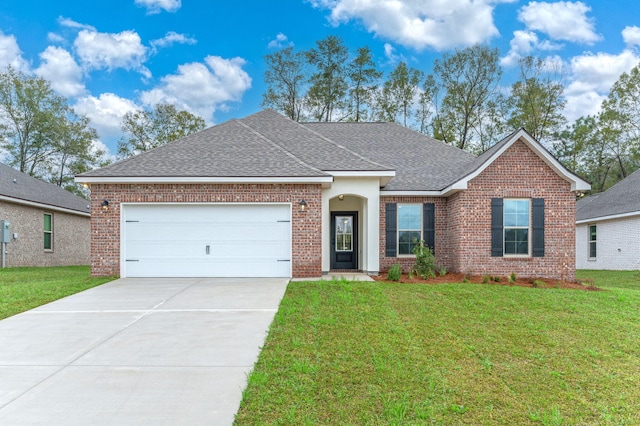 ranch-style house with a garage, brick siding, a shingled roof, driveway, and a front yard