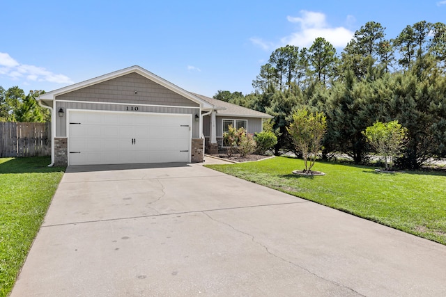 view of front of property with a garage and a front lawn