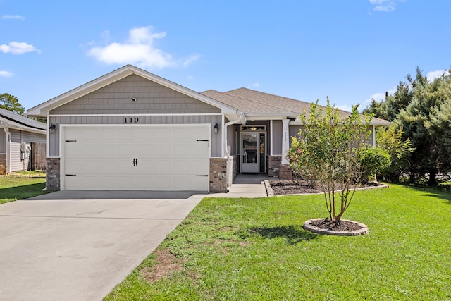 view of front facade with a front yard and a garage