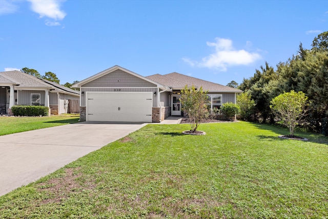 single story home featuring a garage and a front lawn