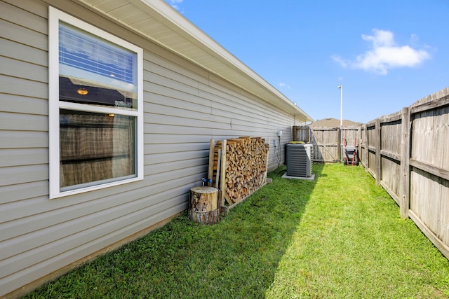 view of yard featuring central air condition unit