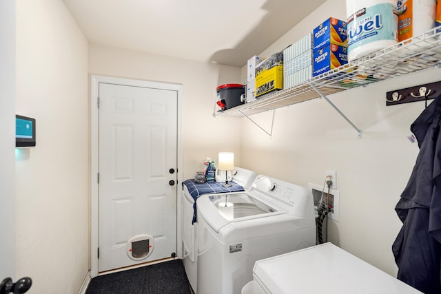 laundry room with independent washer and dryer