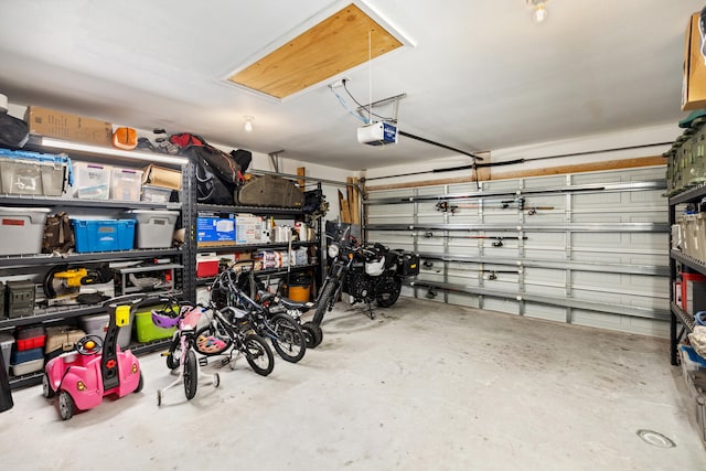 garage featuring a garage door opener