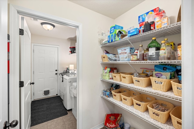 pantry with separate washer and dryer