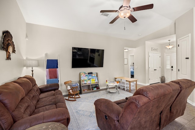 living room with ceiling fan and light tile patterned floors