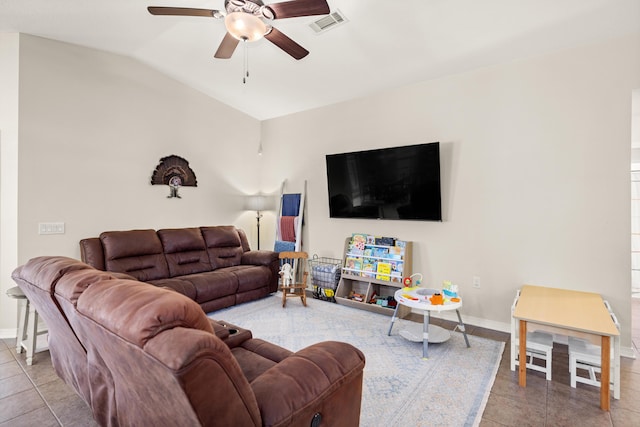 tiled living room featuring vaulted ceiling and ceiling fan