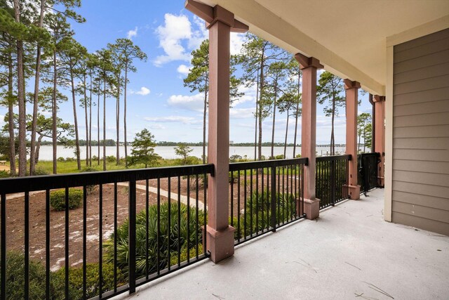 balcony featuring a water view