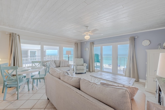 living room with wood ceiling, a water view, light tile patterned floors, ornamental molding, and ceiling fan