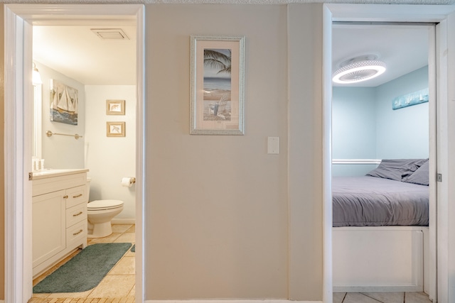 hallway with light tile patterned flooring