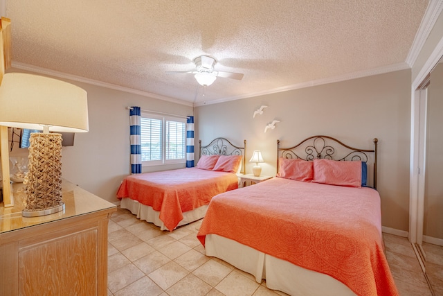 tiled bedroom with ceiling fan, a textured ceiling, a closet, and ornamental molding