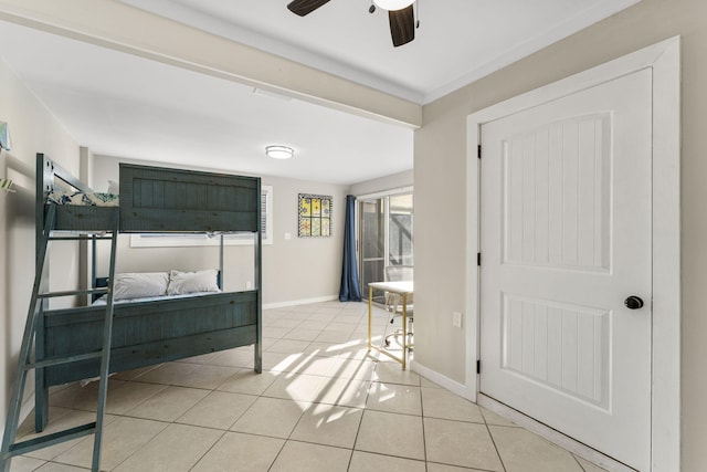 bedroom featuring light tile patterned floors and ceiling fan