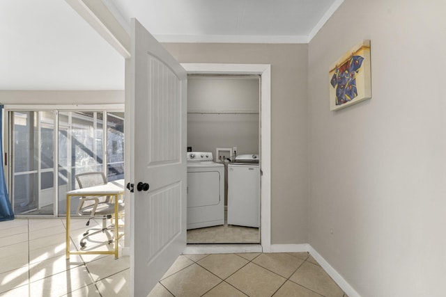 washroom featuring independent washer and dryer and light tile patterned flooring