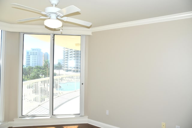 interior space featuring crown molding and ceiling fan