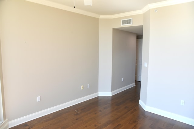 unfurnished room with crown molding and dark hardwood / wood-style flooring