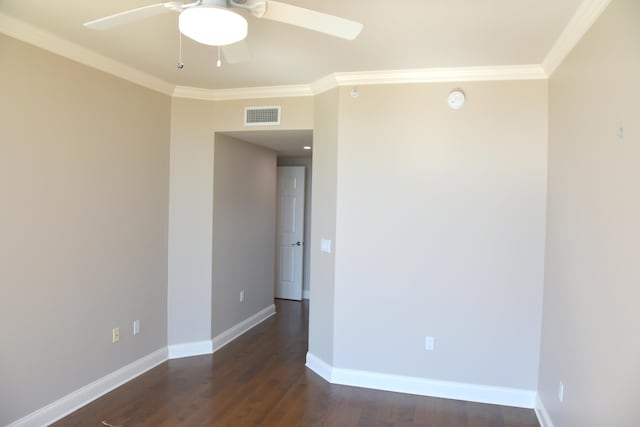 unfurnished room featuring ceiling fan, crown molding, and dark wood-type flooring