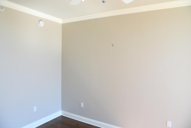 spare room featuring ornamental molding, dark hardwood / wood-style flooring, and ceiling fan