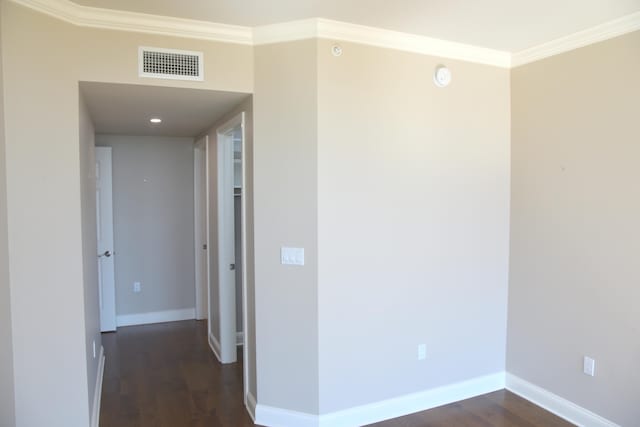 hall featuring crown molding and dark hardwood / wood-style flooring