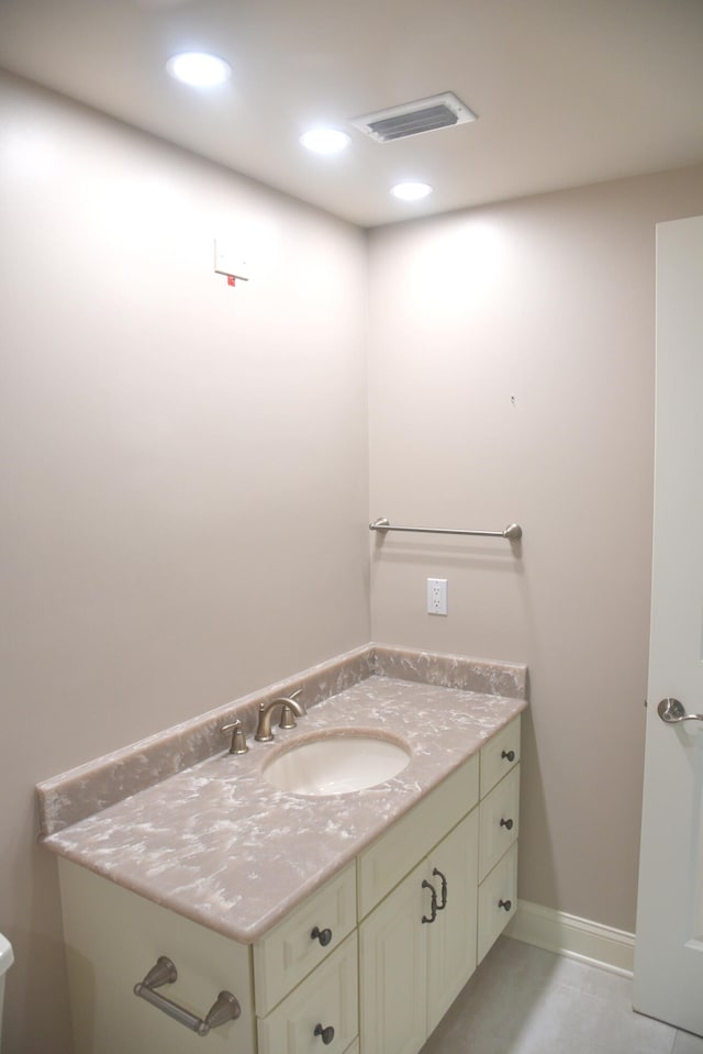 bathroom with tile patterned flooring and vanity