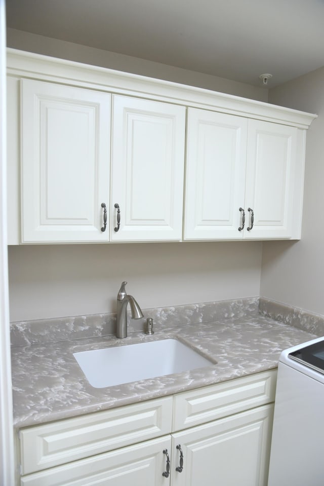 kitchen with sink and white cabinetry