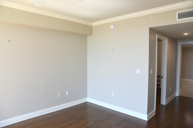 unfurnished room with crown molding and dark hardwood / wood-style flooring