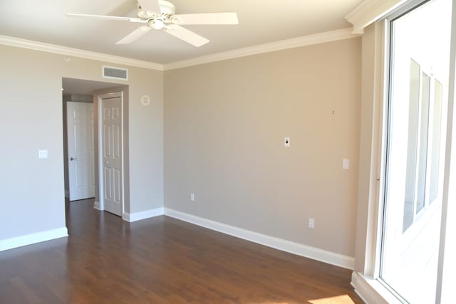 unfurnished room with crown molding, dark hardwood / wood-style flooring, and ceiling fan