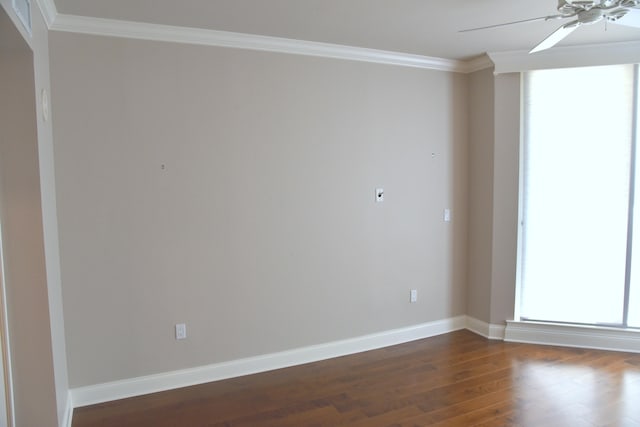 spare room featuring crown molding, ceiling fan, and dark hardwood / wood-style floors