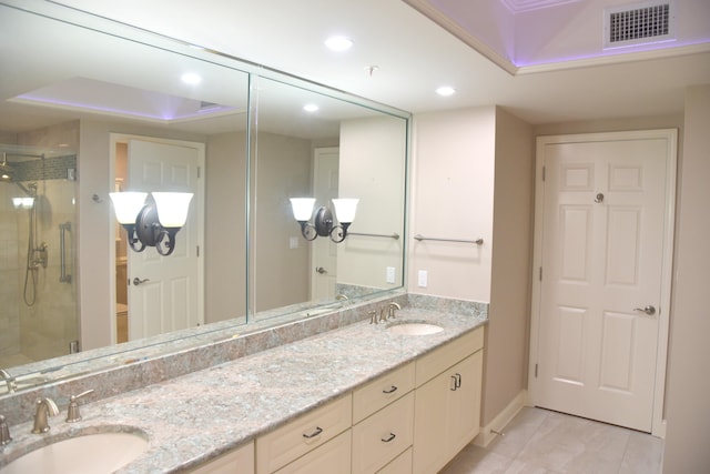 bathroom with toilet, vanity, and walk in shower