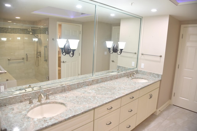 bathroom with vanity and an enclosed shower