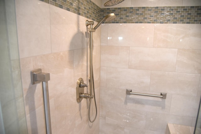 interior space featuring tiled shower