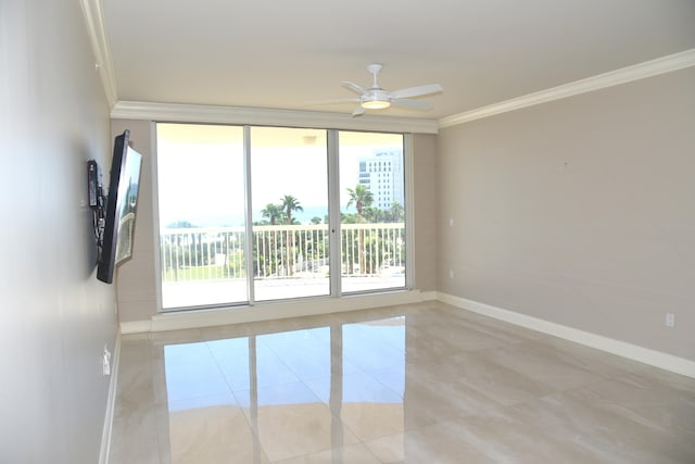 tiled spare room featuring crown molding and ceiling fan