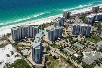 bird's eye view featuring a beach view and a water view