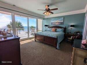 bedroom with ceiling fan, dark colored carpet, and access to exterior