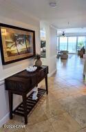 6415 Thomas Dr Unit 205, Panama City Beach, FL 32408 - hallway featuring baseboards