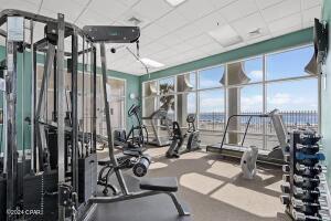 gym with a paneled ceiling