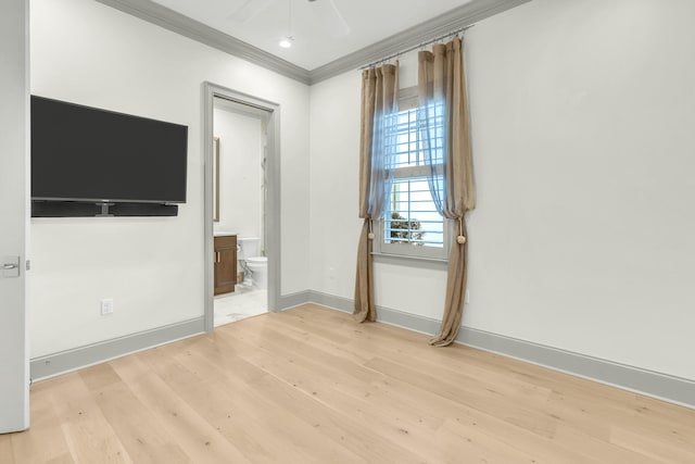 spare room featuring ceiling fan, light hardwood / wood-style flooring, and ornamental molding