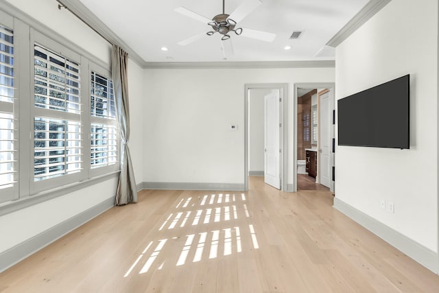 empty room featuring ornamental molding, ceiling fan, and light hardwood / wood-style flooring