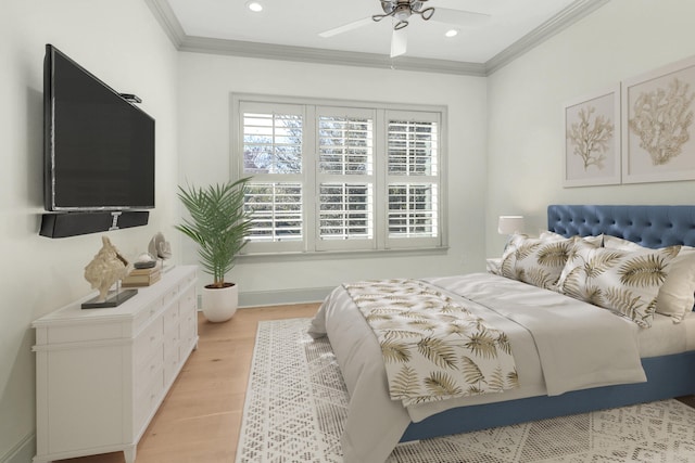 bedroom with ceiling fan, light wood-type flooring, and ornamental molding