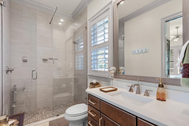 bathroom with ornamental molding, an enclosed shower, vanity, and toilet