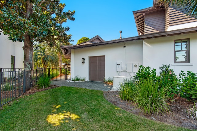 view of home's exterior featuring a lawn and a patio area