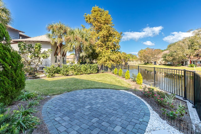 view of patio with a water view