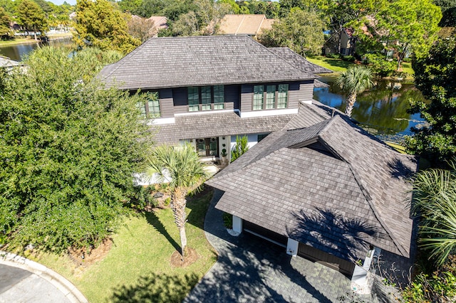 birds eye view of property featuring a water view