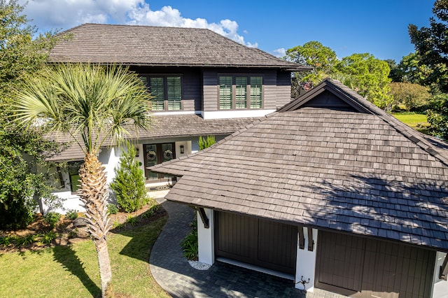 view of side of home featuring a lawn