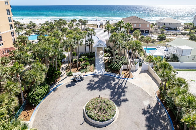 bird's eye view featuring a water view and a beach view