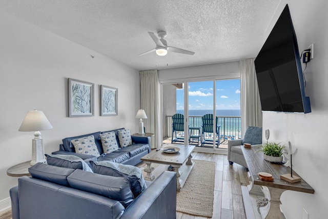 1111 Santa Rosa Blvd Unit 604, Fort Walton Beach, FL 32548 - living room with a textured ceiling, ceiling fan, and light wood-type flooring