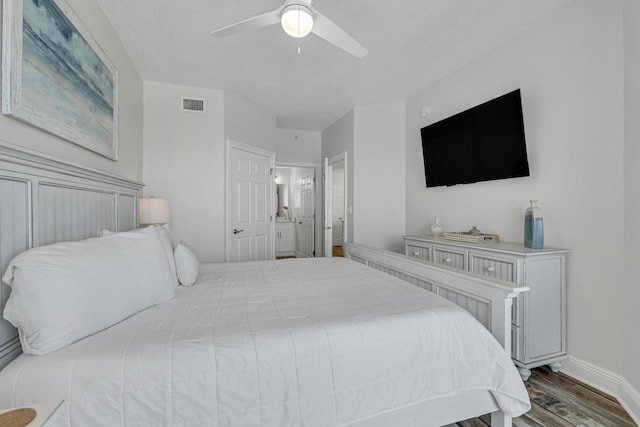 1111 Santa Rosa Blvd Unit 604, Fort Walton Beach, FL 32548 - bedroom featuring baseboards, visible vents, a ceiling fan, ensuite bathroom, and wood finished floors