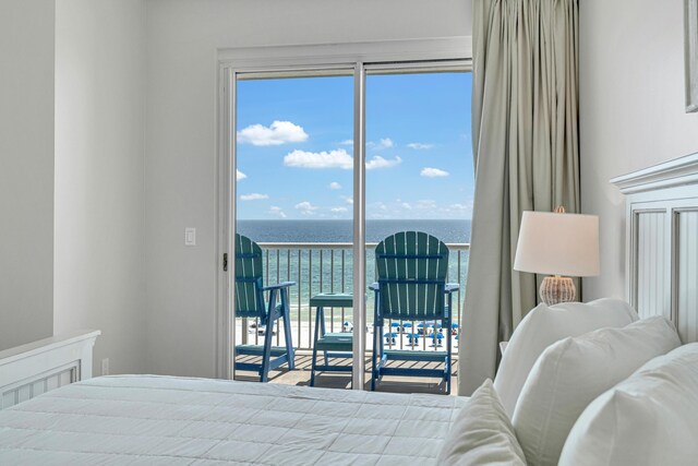 bedroom featuring a water view